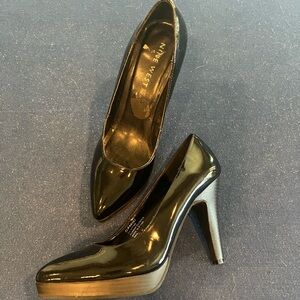 Nine West black pumps.